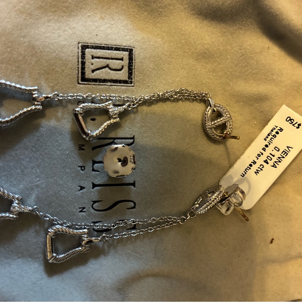 Gorgeous equine earrings with diamond accents on bottom bar $1200 retail